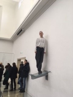 Man standing on low glass platform