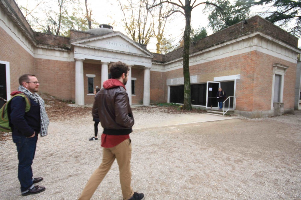 Gomez walks past the American Pavilion