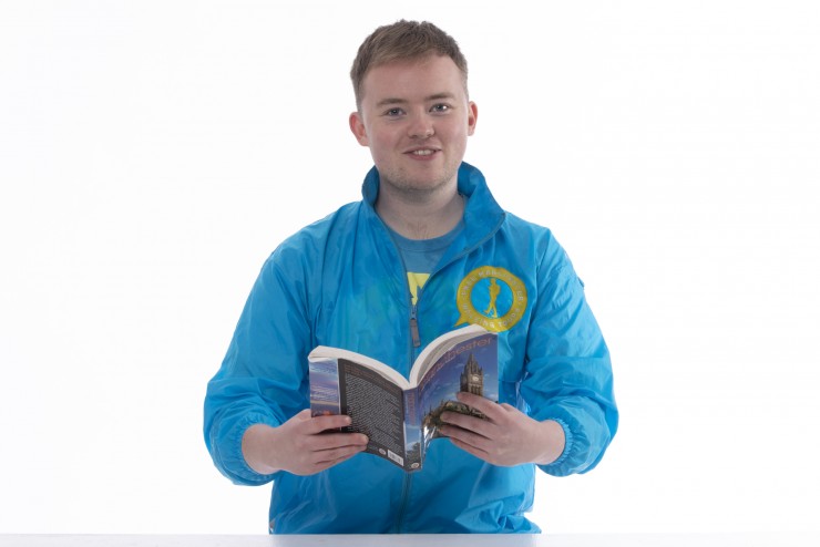 Man reading a book on a white background